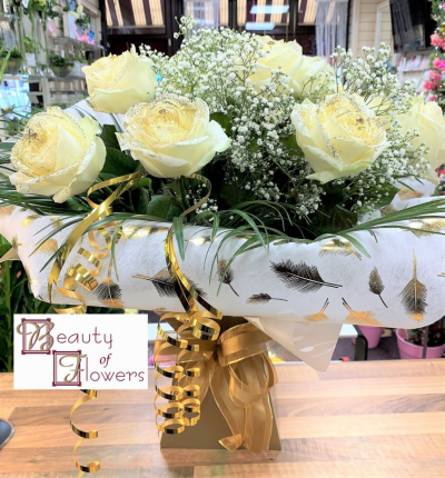 Pure Love - Pure Love, is an utterly beautiful bouquet made from 12 pure white roses, gypsophila and assorted foliage and is unique and hand crafted for you by one of our qualified and experienced team of florists, using the best seasonally available flowers and foliages from all over the world.