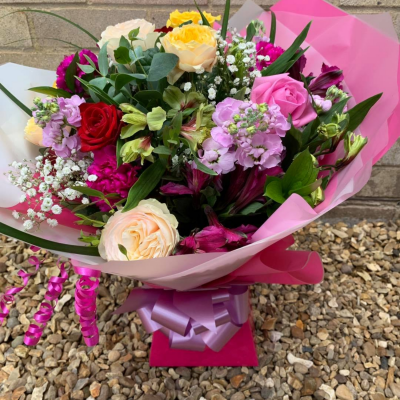 Mrs Kisses - Send lots of love and kisses with this classic hand-tied bouquet featuring a selection of romantic flowers finished with a luxurious single red rose.