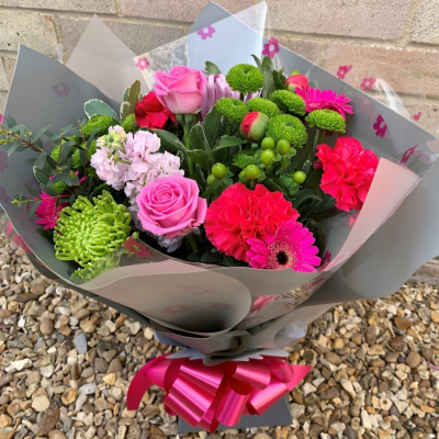 Rosemary - A pink themed hand-tied created in a complimentary gift bag or box. A special gift they’ll remember for years to come.