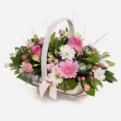 Baby Girl Pink Basket - A floral basket overflowing with pick and white flowers, neatly arranged with foliage.