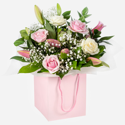 Strawberries & Cream
 - A beautiful collection of roses and lilies hand-tied and delivered in a gift bag or box.