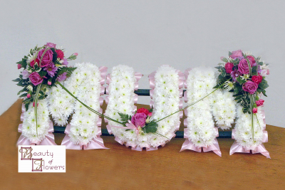 Based Mum - Each letter is created using a ribbon colour of your choice, white chrysanthemum base and a spray on each letter in a colour and flower of your choosing.