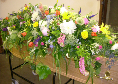 Summer Coffin Spray S012 - Summer coffin spray of flowers for a funeral delivered in Derby by Beauty of Flowers