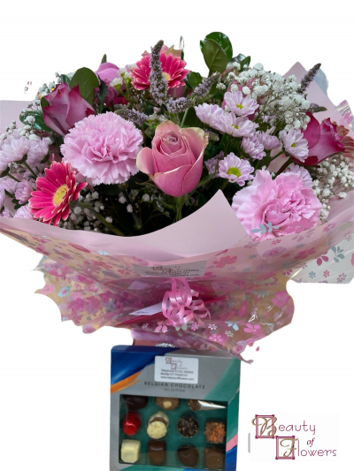 Pink Watered Hand Tied and Chocolates - Watered hand tied and chocolate gift delivered in Derby and Derbyshire by Beauty of Flowers florist