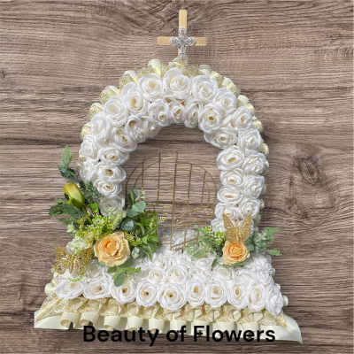 Artificial White and Gold Gates of Heaven - This stunning and beautiful artificial white and gold Gates of Heaven comes in a size of approx. 26" tall. Lovingly prepared personally by our talented florist in our Derby city store. This design can be made in other colour choices. We can also personalise this design with a ribbon sash with a name or short message. Please contact us to discuss your requirements