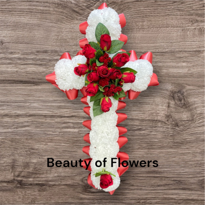 Artificial Red Based Cross - This stunning and beautiful artificial Red Based Cross comes in a size of approx. 24". Lovingly prepared personally by our talented florist in our Derby city store, each design is unique and individual. Flower variety may vary from the picture, but the colour will remain the same. This design can be made in other colour choices. We can also personalize this design with a ribbon sash with a name or short message. Please contact us to discuss your requirements. Artificial funeral flowers are becoming ever more popular due to the fact they last much longer and are a fraction of the price of fresh.