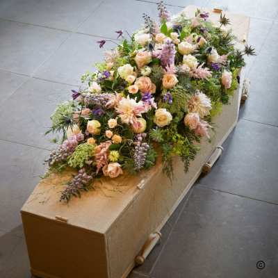 Summer Garden Coffin Spray OFP4 - This coffin spray tribute features a soft, loose and graceful style. Pastel tones evoke a summer garden filled with love. 

Due to seasonal availability some flowers may need to be