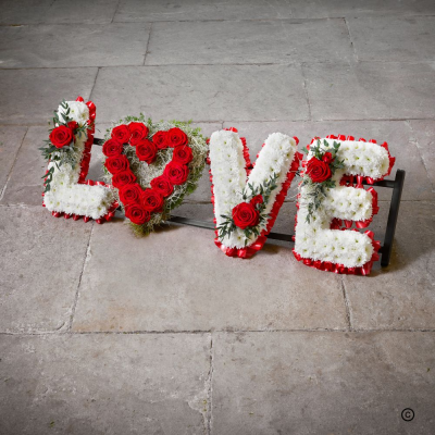 LOVE Letters OFP17(B) - This bespoke and poignant tribute to a cherished loved one is created with red ribbon edge, white chrysanthemums and finished with red roses - the symbolic flower of love and a moving expression of devotion.