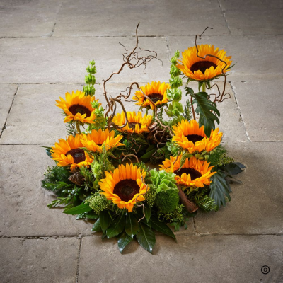 Sunflower Wreath OFP23(D) - Bold sunflower's gives this contemporary wreath a cheery reminder of happier days. Available in 3 sizes.