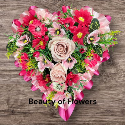 Artificial Pink and Cerise Loose Heart - This stunning and beautiful artificial Pink and Cerise Loose Heart comes in a size of approx. 13". Lovingly prepared personally by our talented florist in our Derby city store, each design is unique and individual. Flower variety may vary from the picture, but the colour will remain the same. This design can be made in other colour choices. We can also personalize this design with a ribbon sash with a name or short message. Please contact us to discuss your requirements. Artificial funeral flowers are becoming ever more popular due to the fact they last much longer and are a fraction of the price of fresh.